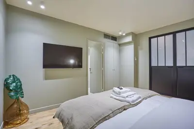 Un ou plusieurs lits dans un hébergement de l'établissement Residence Center of Paris by Studio prestige