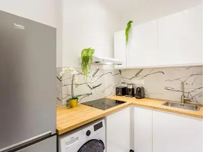 Cuisine ou kitchenette dans l'établissement Merveil - Family Suite - Champs Elysees - Wagram