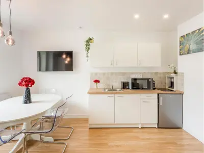 Cuisine ou kitchenette dans l'établissement Merveil - Family Suite - Marais - Martin VI