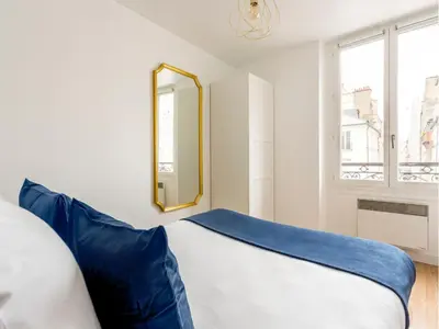 Un ou plusieurs lits dans un hébergement de l'établissement Merveil - Family Suite - Marais - Martin VI