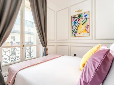 Un ou plusieurs lits dans un hébergement de l'établissement Merveil - Luxury Suite - Opera - Septembre II
