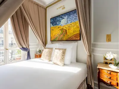 Un ou plusieurs lits dans un hébergement de l'établissement Merveil - Luxury Suite - Opera - Septembre II