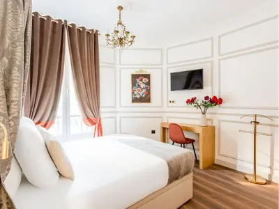 Un ou plusieurs lits dans un hébergement de l'établissement Merveil - Luxury Suite - Opera - Septembre I