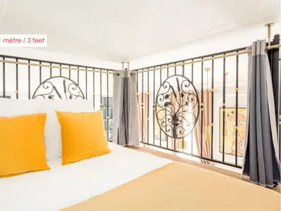 Un ou plusieurs lits dans un hébergement de l'établissement Merveil - Luxury Suite - Opera - Septembre I