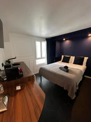 Un ou plusieurs lits dans un hébergement de l'établissement Cocoon Gallery Paris
