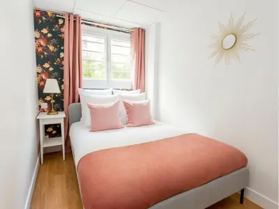 Un ou plusieurs lits dans un hébergement de l'établissement Merveil - Family Suite - Marais - Pelee
