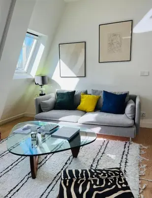 Coin salon dans l'établissement Marais - Appartement sur les toits