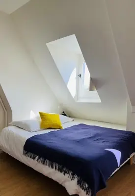 Un ou plusieurs lits dans un hébergement de l'établissement Marais - Appartement sur les toits