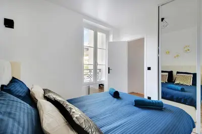 Un ou plusieurs lits dans un hébergement de l'établissement Appartement 4 personnes aux Portes de Paris