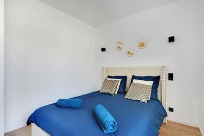Un ou plusieurs lits dans un hébergement de l'établissement Appartement 4 personnes aux Portes de Paris
