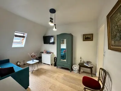 Coin salon dans l'établissement Cosy Studio 5 minutes Tour Eiffel