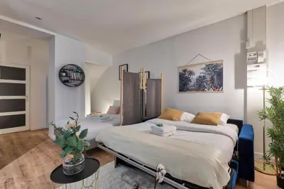 Un ou plusieurs lits dans un hébergement de l'établissement Grand Studio au Cœur de Paris quartier Latin