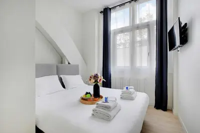 Un ou plusieurs lits dans un hébergement de l'établissement Luxurious apartment - 2BR-6P - Javel-Tour Eiffel