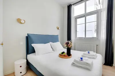 Un ou plusieurs lits dans un hébergement de l'établissement Modern Apartment - 2BR-6P - Eiffel Tower