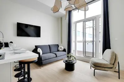 Coin salon dans l'établissement Modern Apartment - 2BR-6P - Eiffel Tower