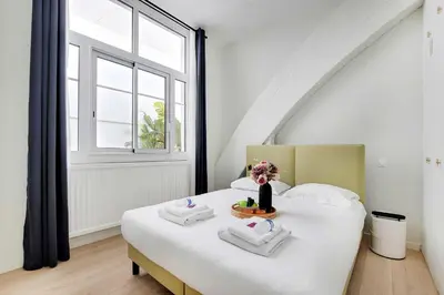 Un ou plusieurs lits dans un hébergement de l'établissement Magnificent apartment - 2BR-6P - Eiffel Tower