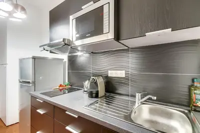 Cuisine ou kitchenette dans l'établissement Sweett - Pavillon Saint-Germain