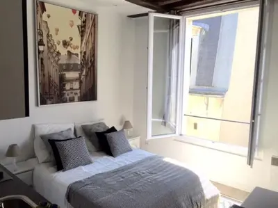 Un ou plusieurs lits dans un hébergement de l'établissement So cute typical french apartment (46)
