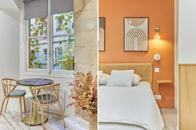 Un ou plusieurs lits dans un hébergement de l'établissement Residence Le Marais by Studio prestige