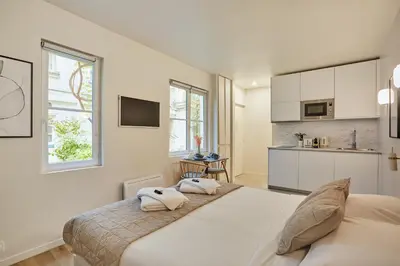 Cuisine ou kitchenette dans l'établissement Residence Le Marais by Studio prestige