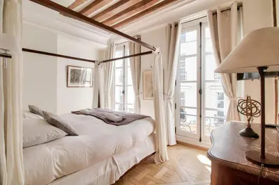 Un ou plusieurs lits dans un hébergement de l'établissement Grandiose appartement au cœur de Paris