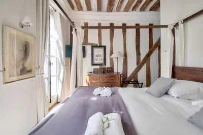 Un ou plusieurs lits dans un hébergement de l'établissement Grandiose appartement au cœur de Paris