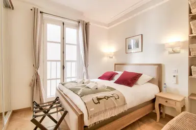 Un ou plusieurs lits dans un hébergement de l'établissement Grandiose appartement au cœur de Paris