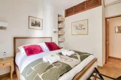 Un ou plusieurs lits dans un hébergement de l'établissement Grandiose appartement au cœur de Paris