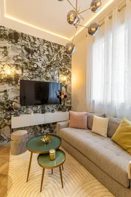 Télévision ou salle de divertissement dans l'établissement Studio avec mezzanine Arc de Triomphe