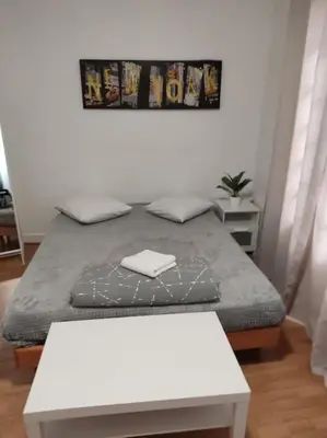 Un ou plusieurs lits dans un hébergement de l'établissement Studio Paris 13