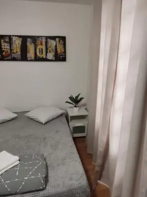 Un ou plusieurs lits dans un hébergement de l'établissement Studio Paris 13