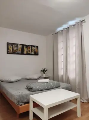 Un ou plusieurs lits dans un hébergement de l'établissement Studio Paris 13
