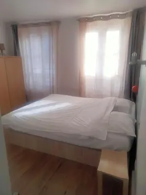 Un ou plusieurs lits dans un hébergement de l'établissement quiet and very central apartment