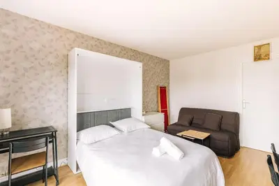 Un ou plusieurs lits dans un hébergement de l'établissement Marvellous Studio Paris 14