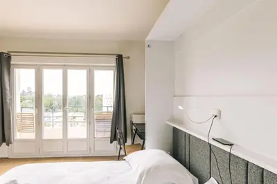 Un ou plusieurs lits dans un hébergement de l'établissement Marvellous Studio Paris 14