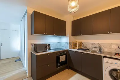 Cuisine ou kitchenette dans l'établissement Your cosy apartment close to Paris