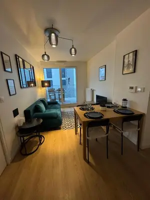 Coin salon dans l'établissement Your cosy apartment close to Paris