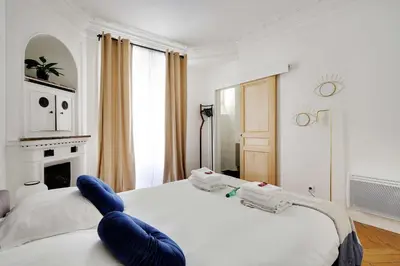 Un ou plusieurs lits dans un hébergement de l'établissement Classy appartment - Arc de Triomphe