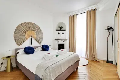 Un ou plusieurs lits dans un hébergement de l'établissement Classy appartment - Arc de Triomphe