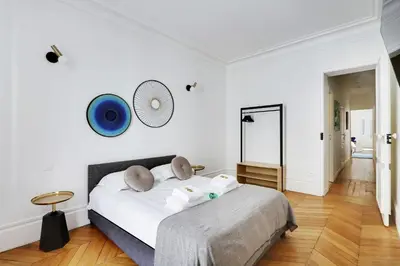 Un ou plusieurs lits dans un hébergement de l'établissement Classy appartment - Arc de Triomphe