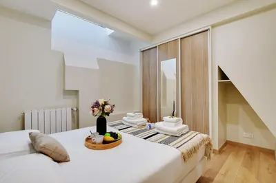 Un ou plusieurs lits dans un hébergement de l'établissement Elegant apartment - 2BR-5P - Champs de Mars