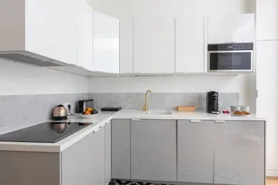 Cuisine ou kitchenette dans l'établissement Cosy Apartment near the Invalides