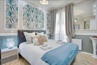 Un ou plusieurs lits dans un hébergement de l'établissement Elégant 120m2 3CH quartier Romantique Centre Ville