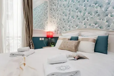 Un ou plusieurs lits dans un hébergement de l'établissement Elégant 120m2 3CH quartier Romantique Centre Ville
