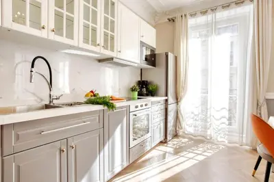 Cuisine ou kitchenette dans l'établissement Elégant 120m2 3CH quartier Romantique Centre Ville