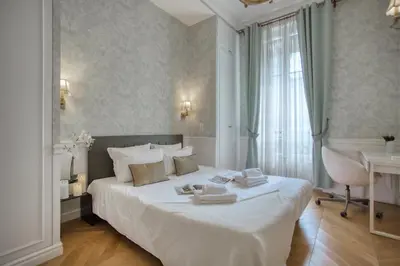 Un ou plusieurs lits dans un hébergement de l'établissement Luxueux 200m2 5CH Champs Elysées à 1min Perle Rare