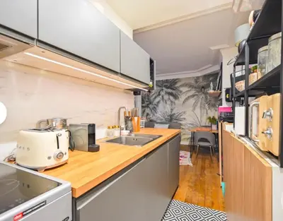 Cuisine ou kitchenette dans l'établissement Appartement cosy quartier Gambetta