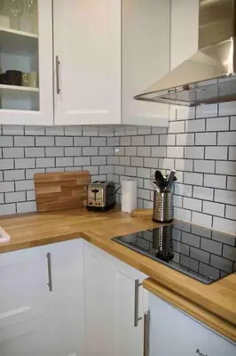 Cuisine ou kitchenette dans l'établissement Another brick in the wall Apartment in Paris Sleeps 9