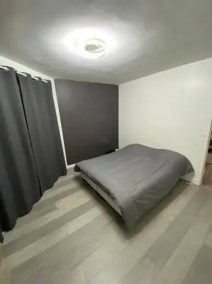 Un ou plusieurs lits dans un hébergement de l'établissement Superbe appartement Vanves T3 avec parking