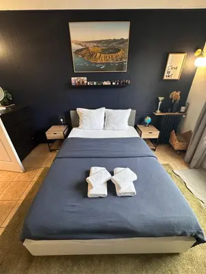 Un ou plusieurs lits dans un hébergement de l'établissement Appartement avec balcon, 5 min du Métro 1-6, Nation, Disneyland, Zoo, Bois de Vincennes